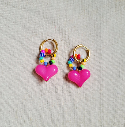 Bright pink heart beaded golden hoop earrings